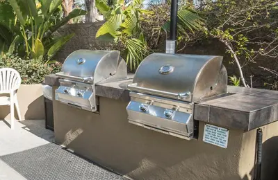 a couple of grill equipment on a wall at Aquamarine Villas in Oceanside