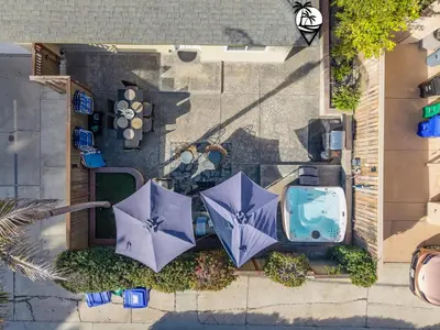 an overhead view of a patio with two purple umbrellas at Windansea Coastal Haven - Steps to Beach in San Diego