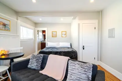 a living room with a couch and a bed at The Heron On Ivy in San Diego