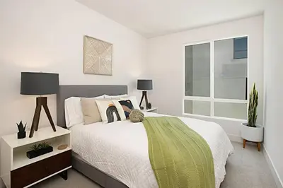 a white bedroom with a bed and a window at Luxury NEW Residence with Private Rooftop, Downtown in minutes in San Diego