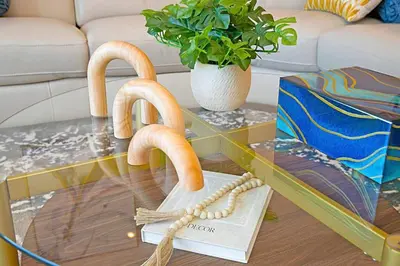 a glass coffee table with two sculptures of buns on it at Luxury NEW Residence with Private Rooftop, Downtown in minutes in San Diego
