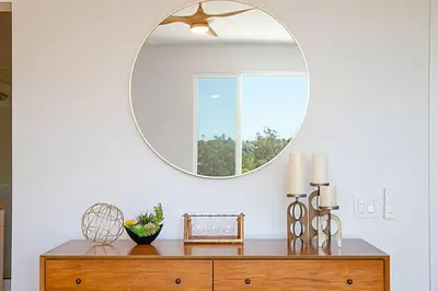a mirror on top of a dresser in a room at Luxury NEW Residence with Private Rooftop, Downtown in minutes in San Diego