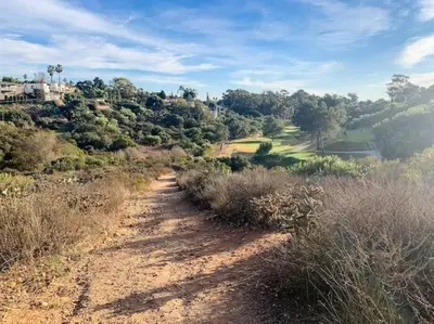 a dirt road leading to a golf course on a hill at Luxury NEW Residence with Private Rooftop, Downtown in minutes in San Diego