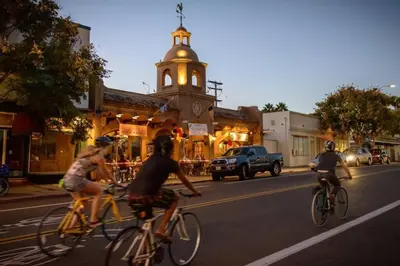 a group of people riding bikes down a city street at Luxury NEW Residence with Private Rooftop, Downtown in minutes in San Diego