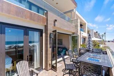 an outdoor patio with a table and chairs at Oceanside Oasis 700S-103 in Oceanside