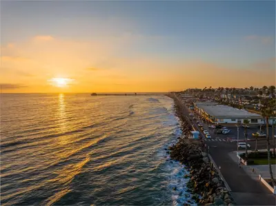 a view of the beach at sunset at Oceanside Oasis 700S-103 in Oceanside