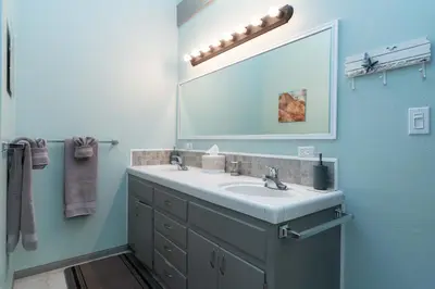 a bathroom with a sink and a large mirror at * - The Leucadia Beach Grotto - * An Encinitas Gem in Encinitas