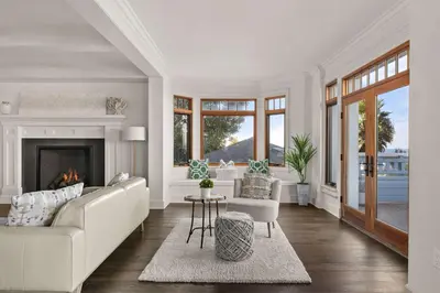 a living room with a white couch and a fireplace at La Jolla Cove-Oceanfront 5600SF 3BR+Loft 5BA House best Villiage location walk everywhere in San Diego