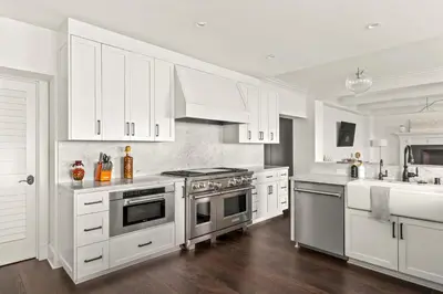 a kitchen with white cabinets and stainless steel appliances at La Jolla Cove-Oceanfront 5600SF 3BR+Loft 5BA House best Villiage location walk everywhere in San Diego