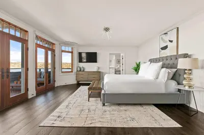 a bedroom with a white bed and a television at La Jolla Cove-Oceanfront 5600SF 3BR+Loft 5BA House best Villiage location walk everywhere in San Diego