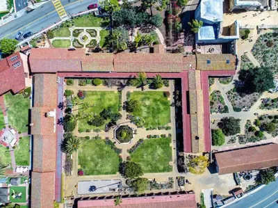 an aerial view of a building with a garden at Casa de Vaqueros! Family&Pet Friendly! 3mi to the Beach! in San Juan Capistrano