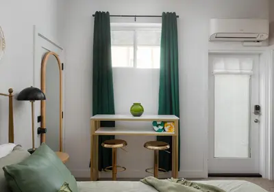 a bedroom with a bed and a window with green curtains at 2 Free Bikes, Pvt Parking, Steps to Beach! South Mission Beach in San Diego
