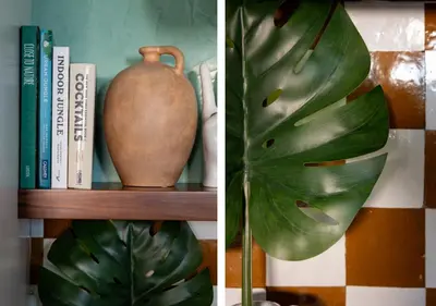 a plant and a vase on a shelf with books at 2 Free Bikes, Pvt Parking, Steps to Beach! South Mission Beach in San Diego