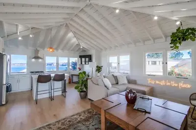 a living room with a couch and a table at Blue Water View Condo in Prime Coastal Locale in San Diego
