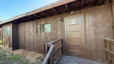 a wooden building with a door and a porch at Walking Distance to Little Italy in San Diego