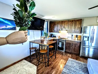 a kitchen with a table and chairs and a refrigerator at #2 - The Eagle's Perch in Pauma Valley