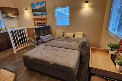 a living room with a large bed in a room at #7 Josie's Mountain Top Hideout-Cabin in the Woods in Santa Ysabel