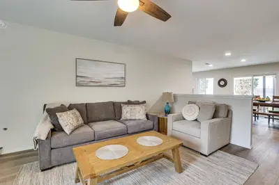 a living room with a couch and a table at Sunny Oceanside Home with Patio, 5 Mi to Downtown! in Oceanside