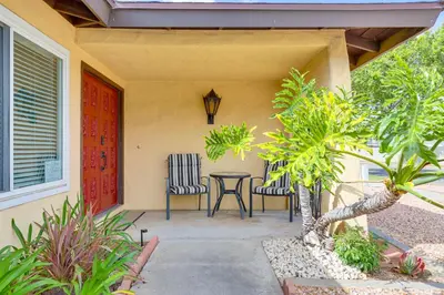 a patio with two chairs and a table on a house at Sunny Oceanside Home with Patio, 5 Mi to Downtown! in Oceanside