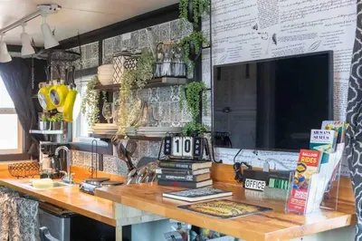 a counter with books on it in a kitchen at #13 - The Raven - Tiny Home (Edgar Allan Poe) in Santa Ysabel