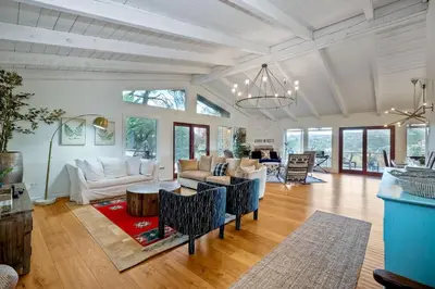 a living room with a couch and a table at City Getaway, Hot Tub, Fire Pit, Game Room, BBQ, Hiking Trails, Vineyard Views, B-Ball in Fallbrook