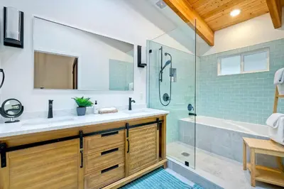 a bathroom with a sink and a shower and a tub at City Getaway, Hot Tub, Fire Pit, Game Room, BBQ, Hiking Trails, Vineyard Views, B-Ball in Fallbrook