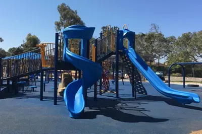 a playground with a blue slide in a park at SPECIAL OFFER - Modern Apartment in La Jolla UTC - Close to Beaches, Shopping, Dining, UCSD in San Diego