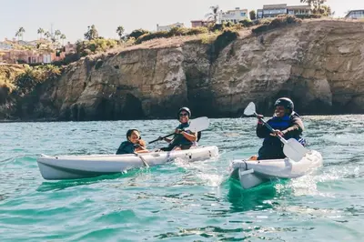 three people are in kayaks in the water at SPECIAL OFFER - Modern Apartment in La Jolla UTC - Close to Beaches, Shopping, Dining, UCSD in San Diego