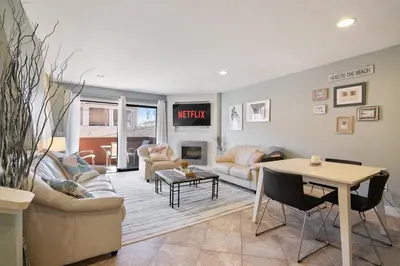 a living room with a couch and a table at IB Coastal Condo - Imperial Beach - Shops - Patio in Imperial Beach