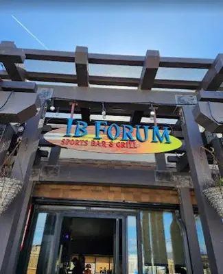a sign for a store with a surfboard on it at IB Coastal Condo - Imperial Beach - Shops - Patio in Imperial Beach