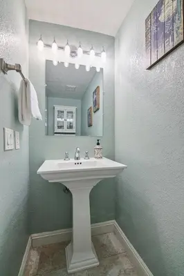 a bathroom with a white sink and a mirror at IB Coastal Condo - Imperial Beach - Shops - Patio in Imperial Beach