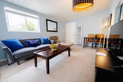 a living room with a couch and a table at Idyllic 1BR APT in Ocean Beach in San Diego