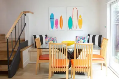 a dining room with a table and chairs at Geometric Loft: renovated, hip, pets, pool/spa in Solana Beach