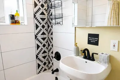 a bathroom with a sink and a shower at Sunset Haven: Lakeside Charm in Ocean Beach in San Diego