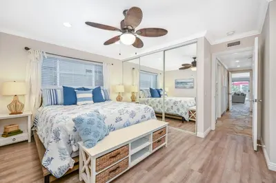 a bedroom with a bed and a mirror at Three Bedroom Home on 36th with Indoor Outdoor Living in Newport Beach