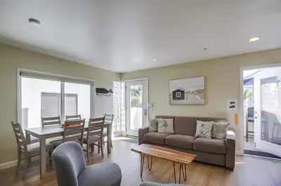 a living room with a couch and a table at Contempo Coastal in San Diego