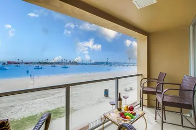 a balcony with a view of the beach at Waterfront 1 in San Diego