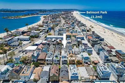 an aerial view of a beach with houses at Sand & Sea in San Diego
