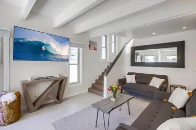 a living room with a couch and a table at Sand & Sea in San Diego
