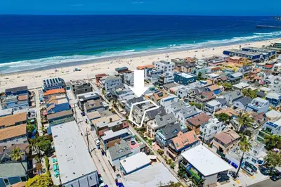 an aerial view of a beach with condos at Sand & Sea in San Diego