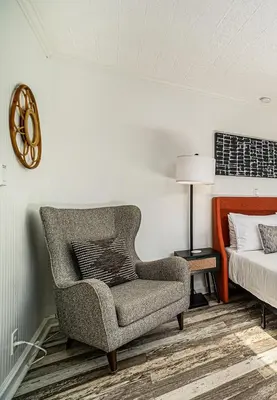 a bedroom with a chair and a bed at Cozy Studio with Outdoor Oasis in Bonita