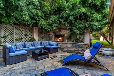 a patio with a couch and a fire place at Ocean-View Mountaintop Getaway. Jacuzzi/Ping-Pong! in San Diego