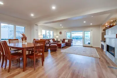a living room with a table and a couch at Point Loma Serenity in San Diego