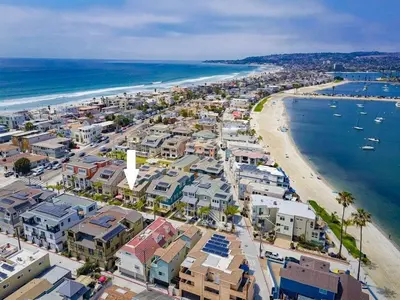 an aerial view of a beach with houses and boats at Bayside Cove 5 in San Diego