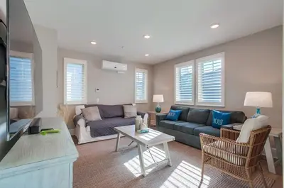 a living room with a couch and a table at Bayside Cove 4 in San Diego