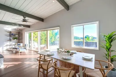 a dining room with a table and some chairs at Tropical Retreat in San Diego