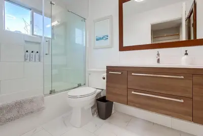 a bathroom with a toilet and a shower and a sink at Tropical Retreat in San Diego