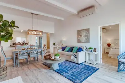 a living room with a couch and a table at Jetty View 1 in San Diego