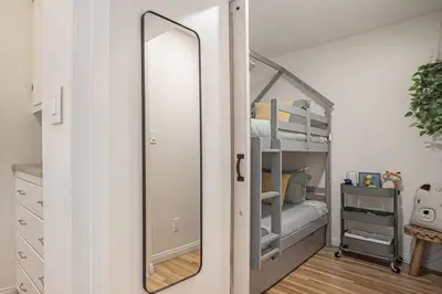 a mirror in a bedroom with a bunk bed at Boutique Charm 3BR w/ Huge Deck in Bonita