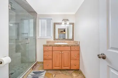 a bathroom with a sink and a shower at Giant 7 Bedroom Home with 3 separate Condos in Newport Beach